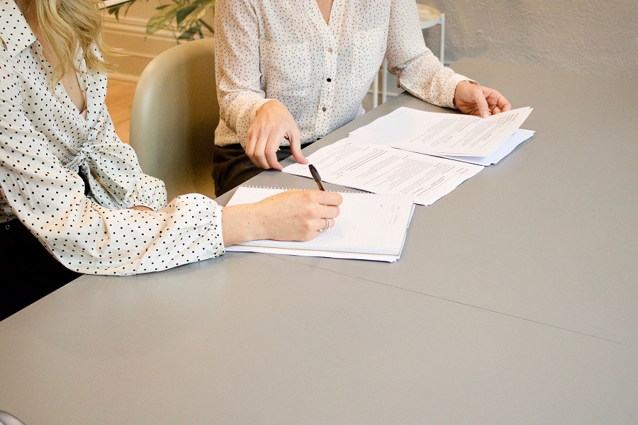 woman preparing Texas divorce papers on her own