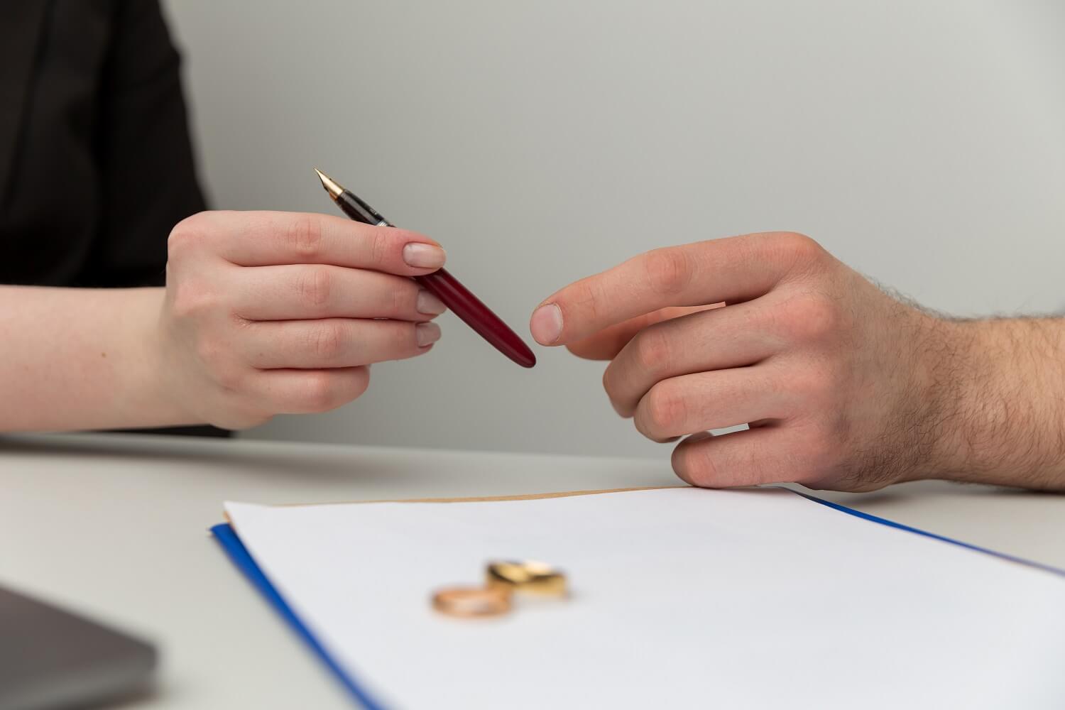 couple beginning diy divorce in Texas by signing documents