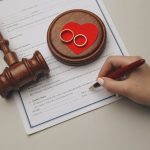 woman signing documents for texas divorce process